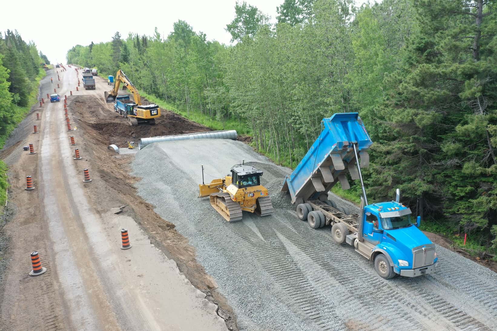 There is a method to the madness! Heavy machinery is all doing its thing while motorists gape. Someday the traffic will flow again easily on this highway reconstruction project by LH North.