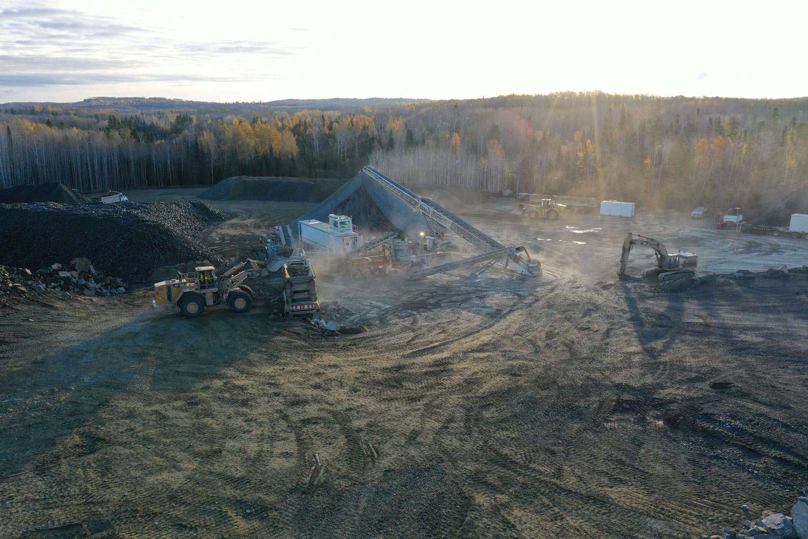 There is sand and gravel everywhere and heavy machinery kicks up dust in this highway construction site, a project by LH North.